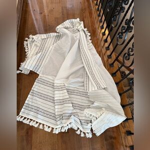 Levtex baby brand crib dust ruffle bohemian style with fringed edge.